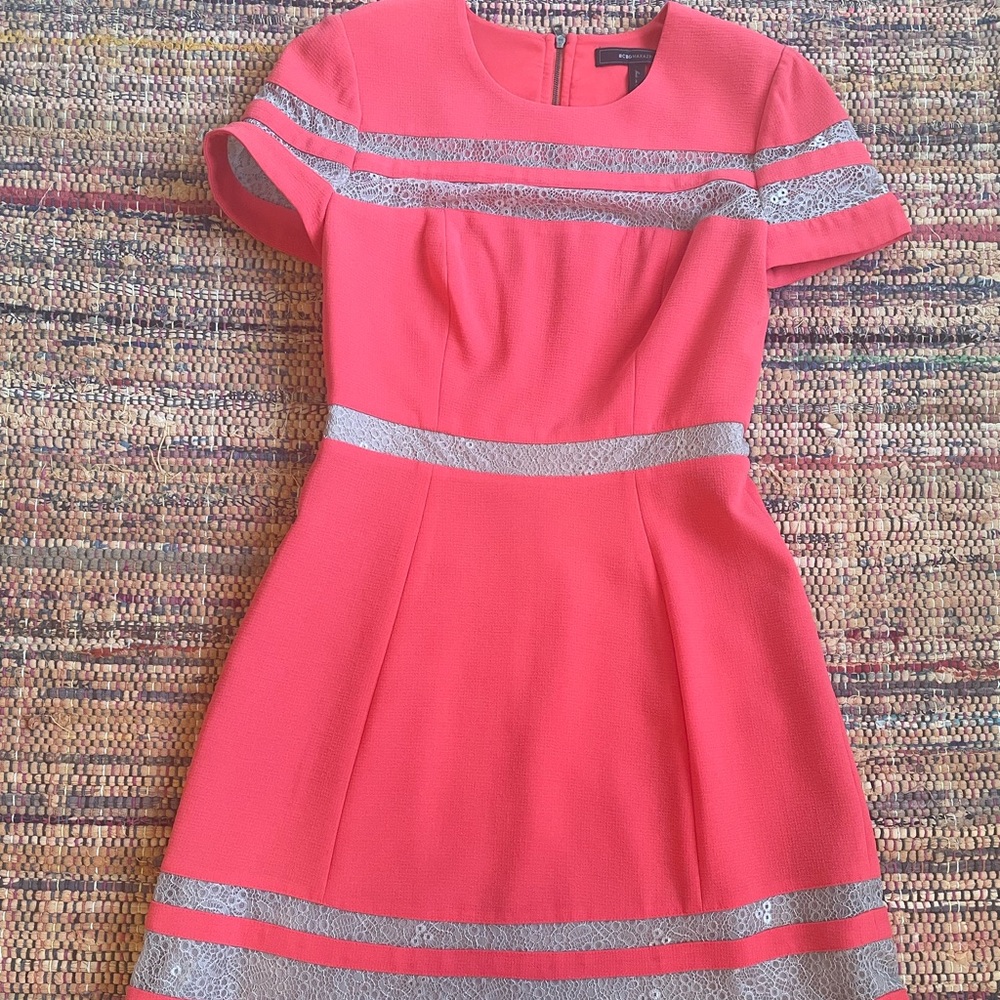 Worn once to a wedding, beautiful orange/red 100% polyester Lace dress.